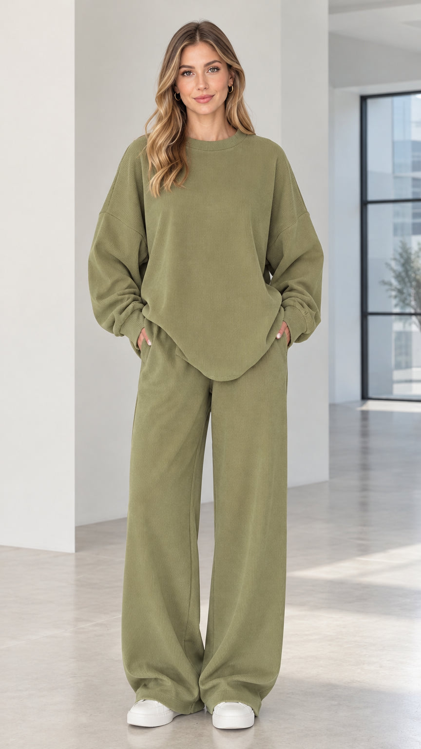 Front full view of woman wearing olive green ribbed oversized sweatshirt and wide-leg lounge pants set