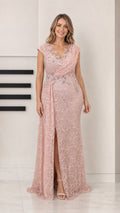 Front view of woman wearing blush pink sequin lace evening gown with draped neckline and front slit