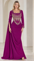 Front full-length view of model wearing magenta embellished square neck evening gown with side drape