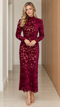 Front view of model wearing burgundy long sleeve floral lace mock neck maxi dress