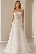 Front view of model wearing full-length ivory off-shoulder pearl lattice beaded evening gown