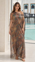 Front view of woman wearing Bronze Multi asymmetrical kaftan maxi dress with ruched shoulder