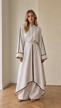 Full front view of beige mandarin collar asymmetrical tunic top and matching wide leg pants set