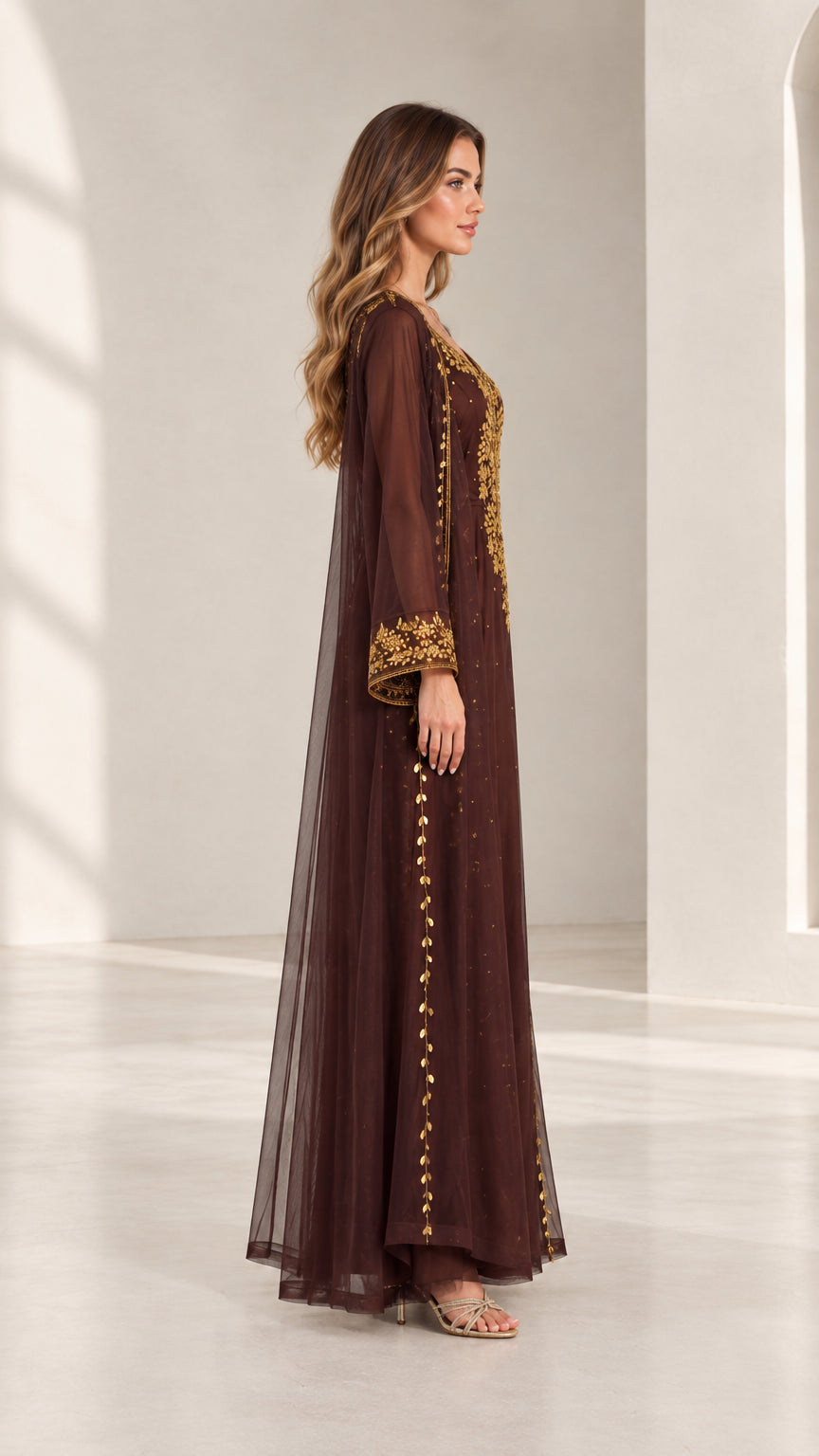 Side profile view of woman wearing chocolate brown embroidered kaftan maxi dress