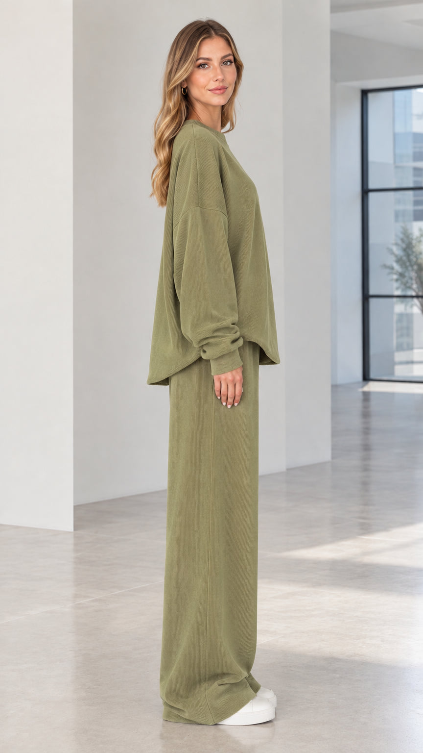 Side angle of woman wearing olive green two-piece ribbed matching lounge set