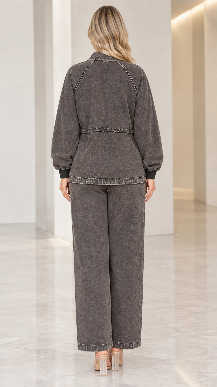Back view of model showing relaxed fit of the Washed Charcoal jacket and wide pants