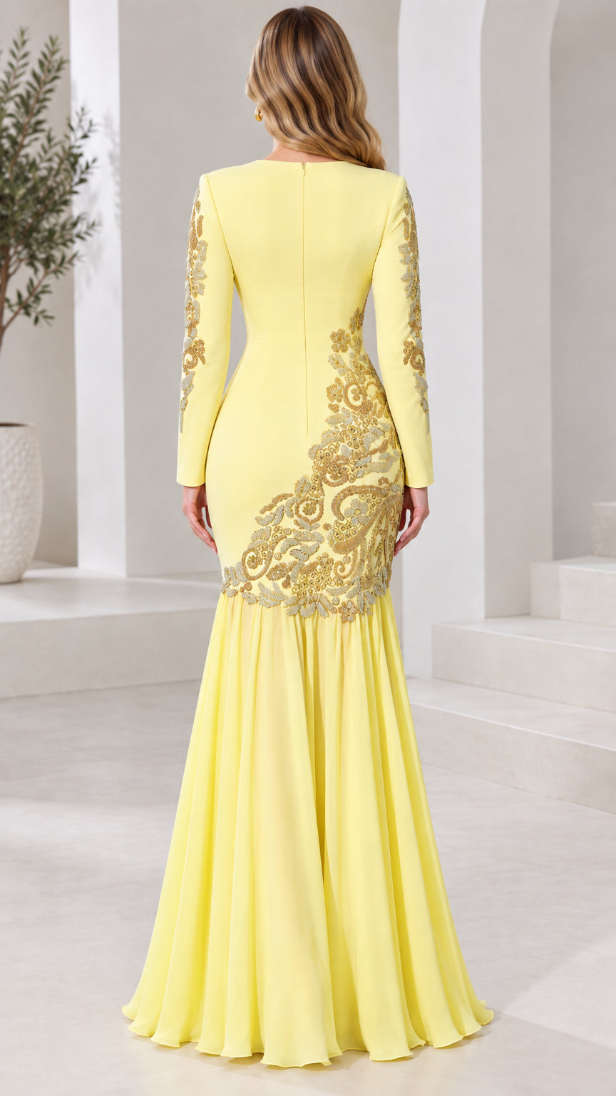 Back view of pastel yellow floor-length mermaid gown showing fit and embroidery