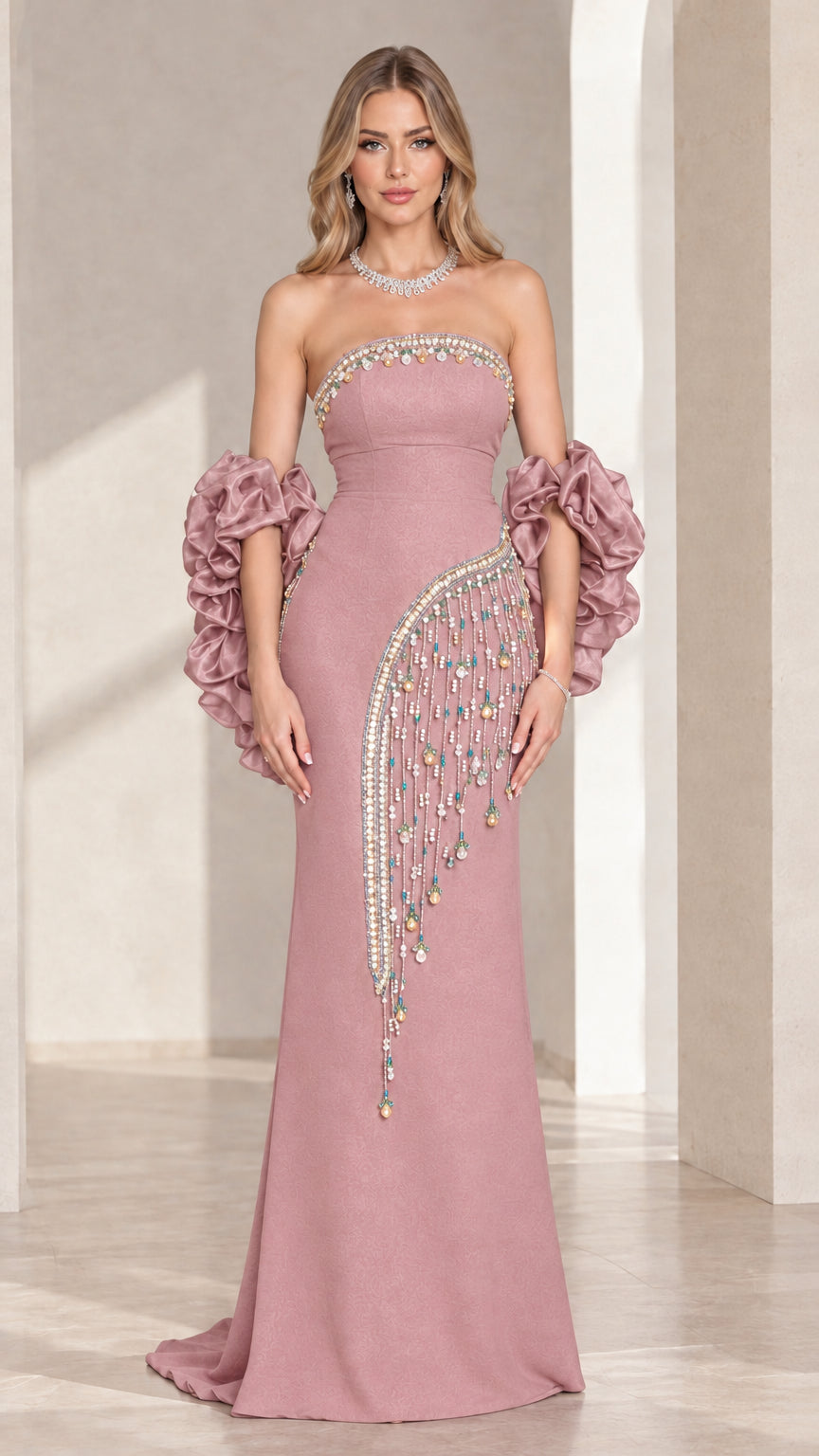 Dusty pink strapless beaded evening gown with ruffled sleeve cuffs