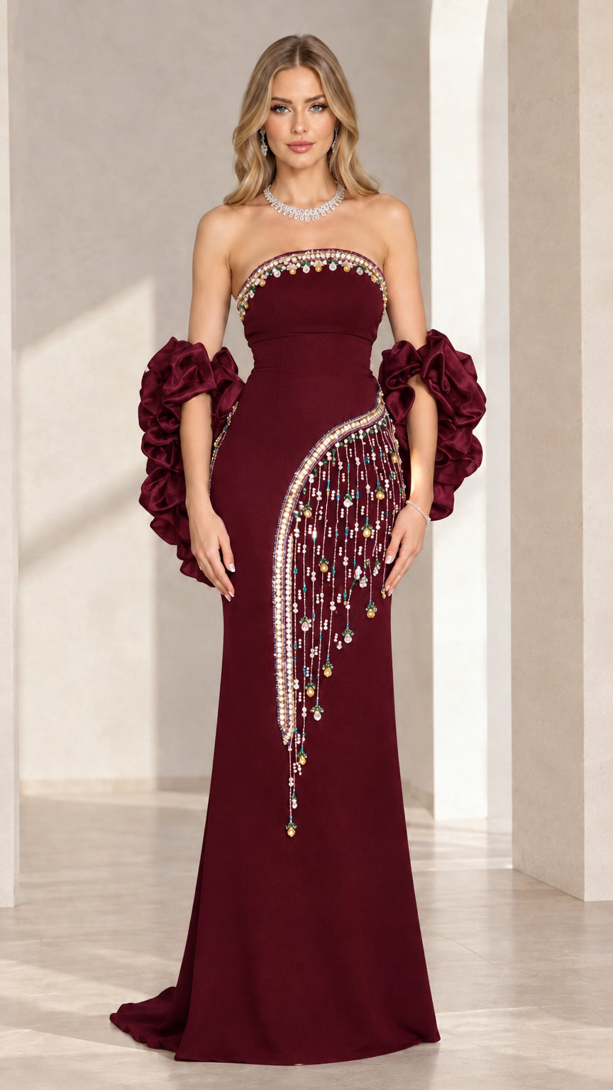 Burgundy strapless column evening dress with beaded accents and ruffles
